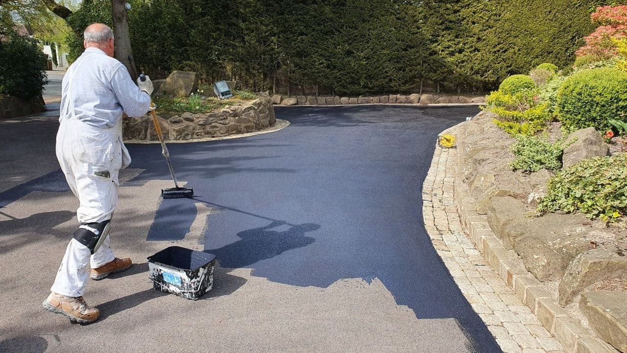 Close-up of wet asphalt surface texture after cleaning